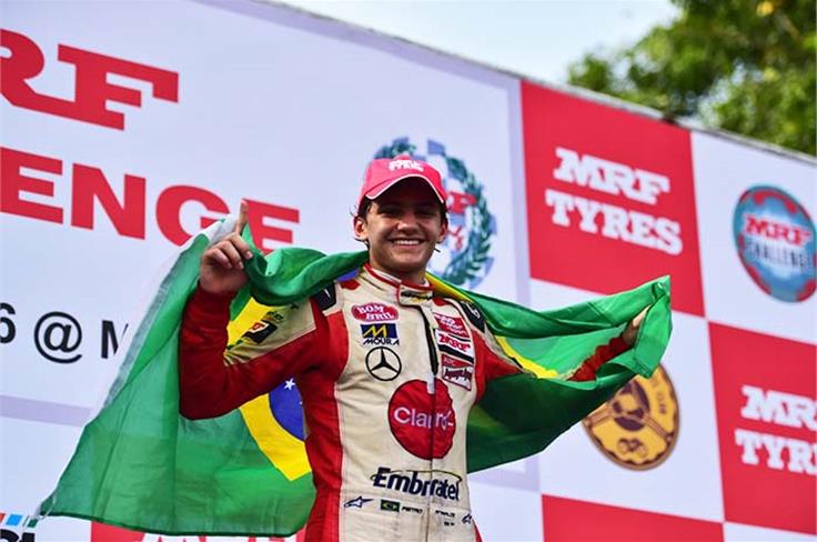 Pietro Fittipaldi with the Brazilian flag after sealing the title.